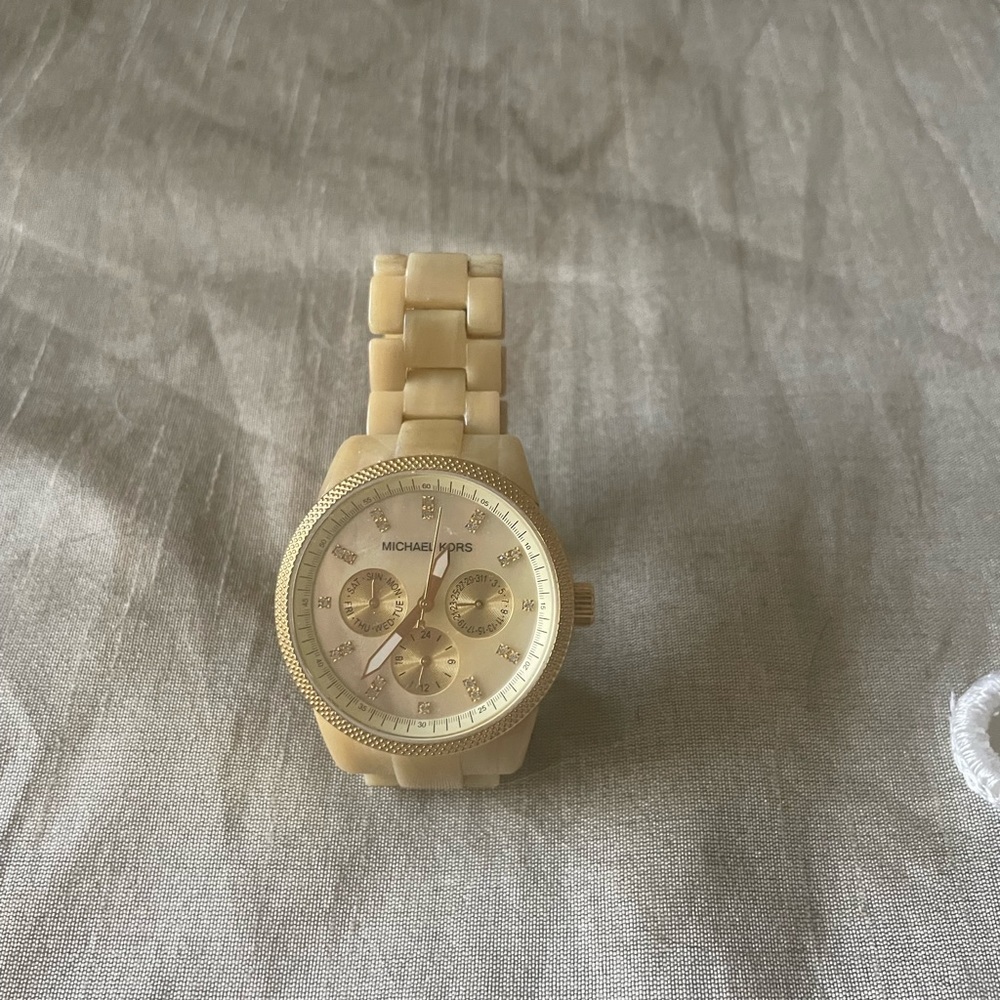 Michael Kors watch. Will need to be restarted. But works perfectly. Worn once.